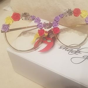 Embellished with Swarovski crystano script frames